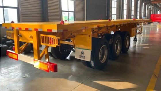 Wosheng ha un carico massimo di 30000 kg 3 assi 4 assi contenitore in acciaio semirimorchio a letto piatto