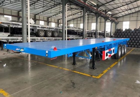 Wosheng ha un carico massimo di 30000 kg 3 assi 4 assi contenitore in acciaio semirimorchio a letto piatto