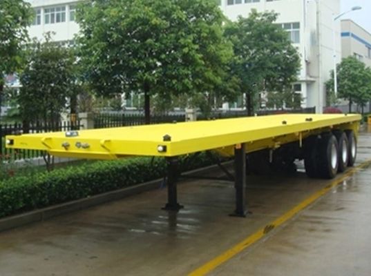 Q345b Fascio principale 3 assi 20ft 40ft Container Trasporto 60-100Tons Flat bed Flatbed Truck Semi-trailer